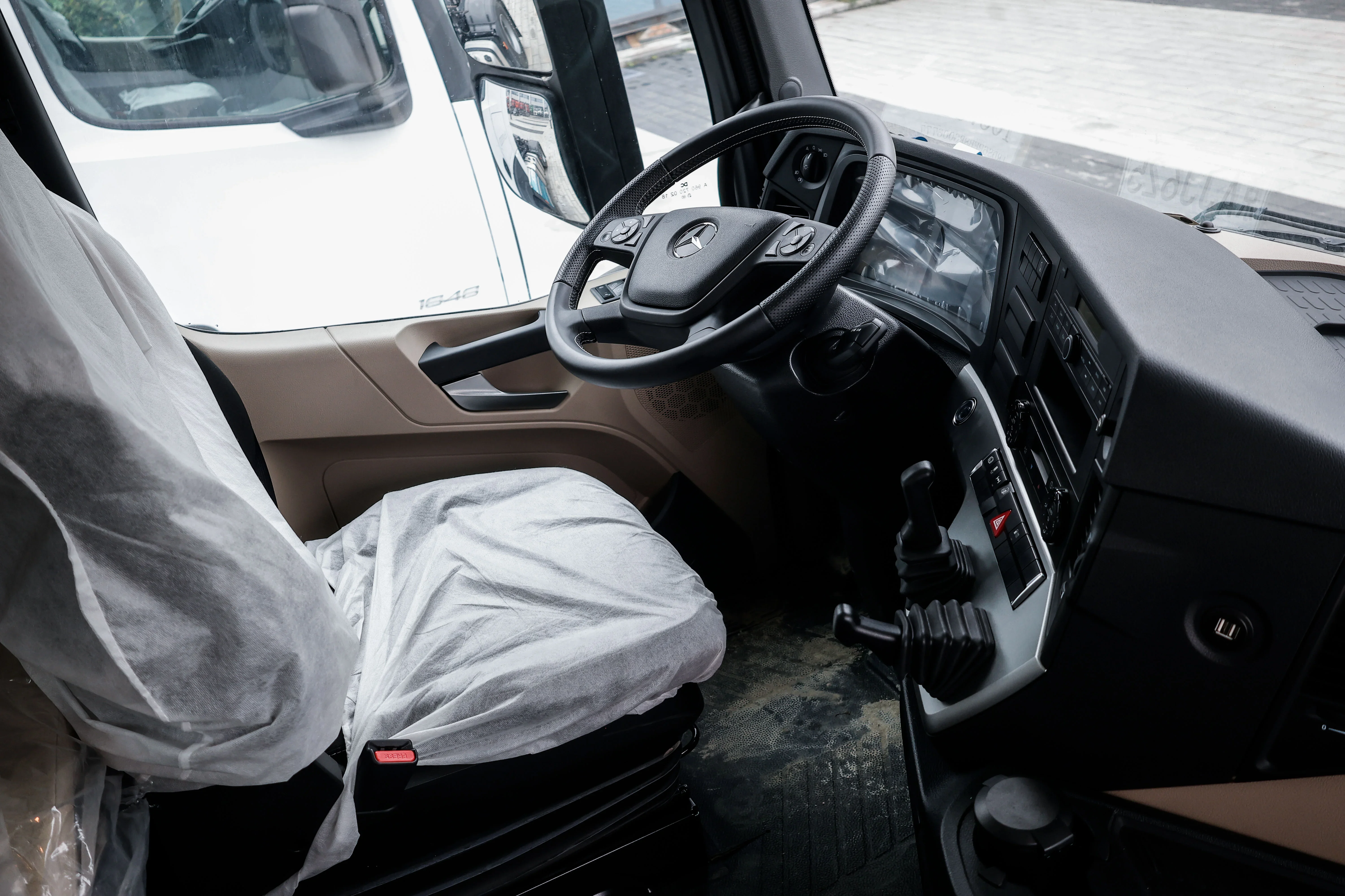 Mercedes-Benz Actros 1848 tractor truck cab interior and driver seat.webp